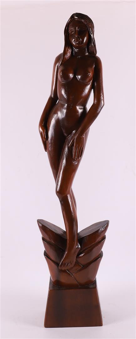 A carved tropical wooden sculpture of a female nude, 20th century.