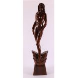 A carved tropical wooden sculpture of a female nude, 20th century.