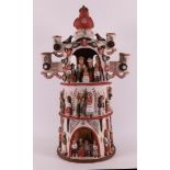 A ceramic candlestick with Central American figures, late 20th century.