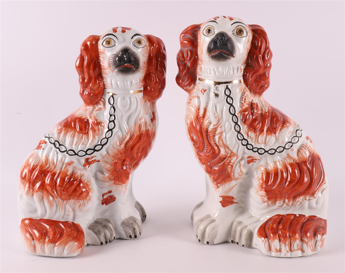 A pair of brown/white earthenware dogs, England, Staffordshire, 19th century.