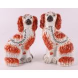 A pair of brown/white earthenware dogs, England, Staffordshire, 19th century.