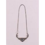A first grade silver choker with 1 oval blue stone and many marcasites