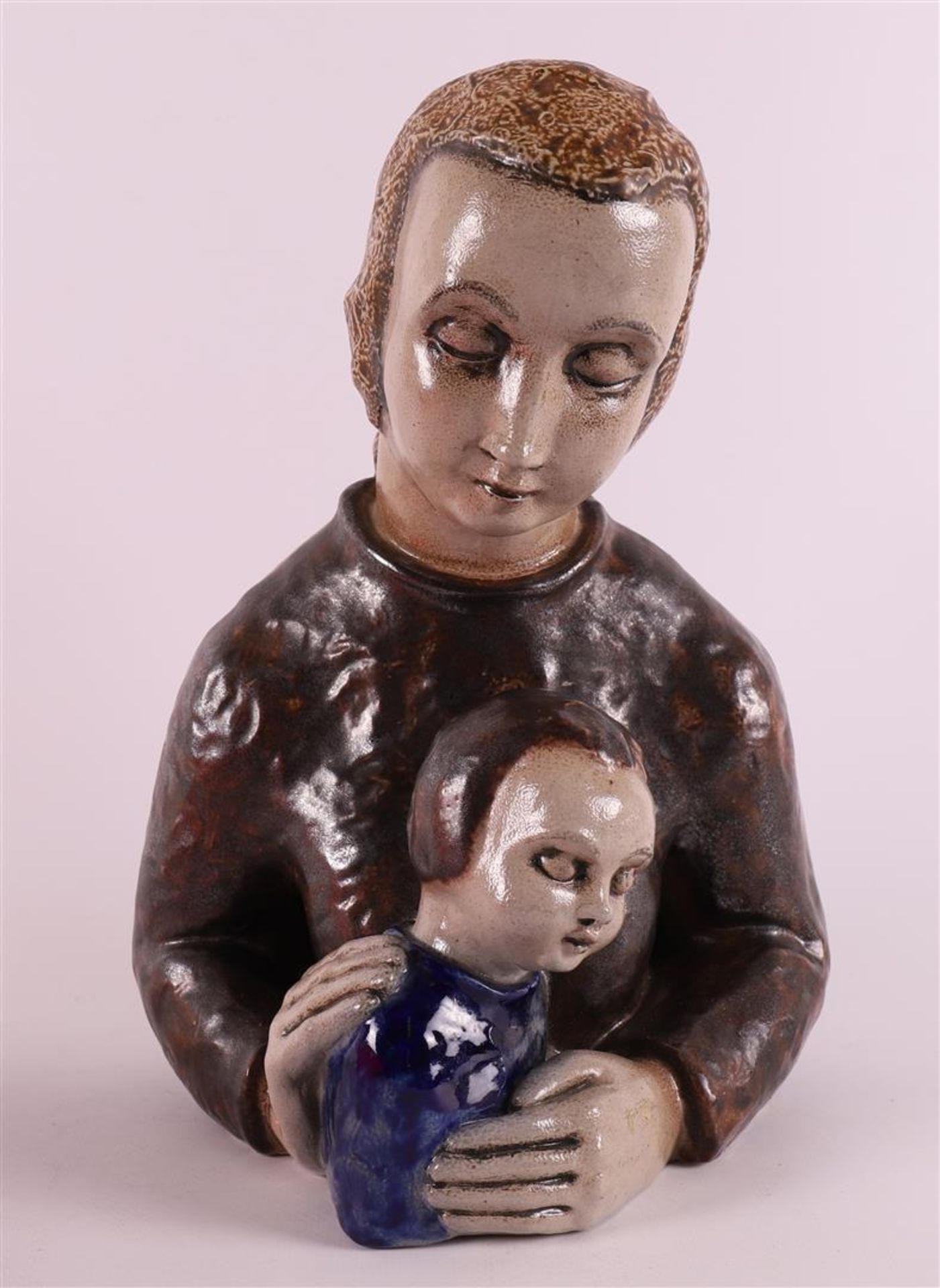 A ceramic sculpture of mother with child, signed: Elfriede Balzar-Kopp,