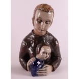 A ceramic sculpture of mother with child, signed: Elfriede Balzar-Kopp,