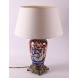 A porcelain Imari lamp base with brass frame, Japan, Meiji, around 1900.