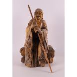 A carved wooden philosopher with staff, China, 2nd half of the 19th century.