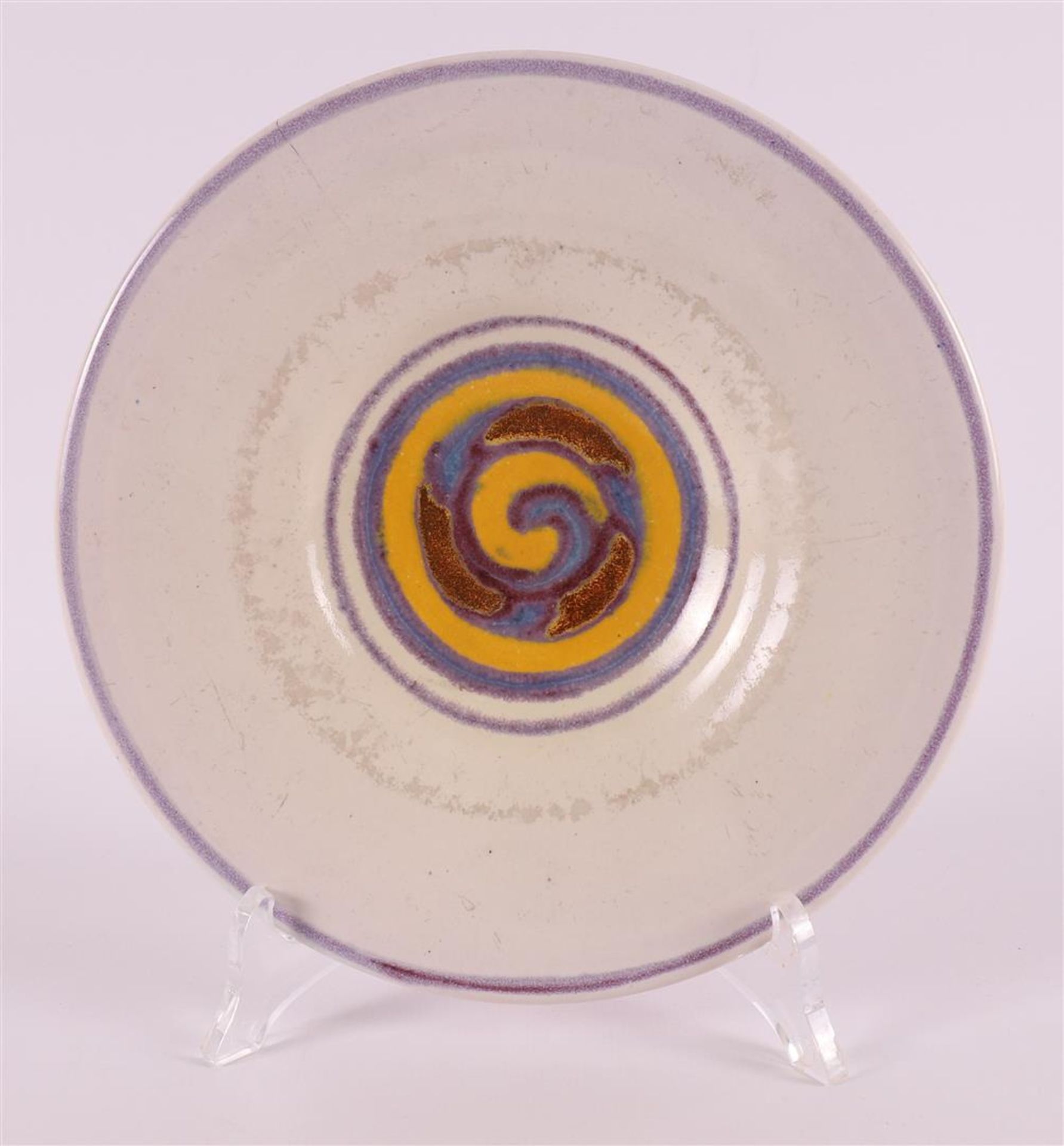 A round glazed earthenware dish, 1923-1930.