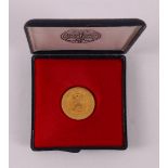 A gold coin '50 Uniedaalders 1979 - Unie van Utrecht'.