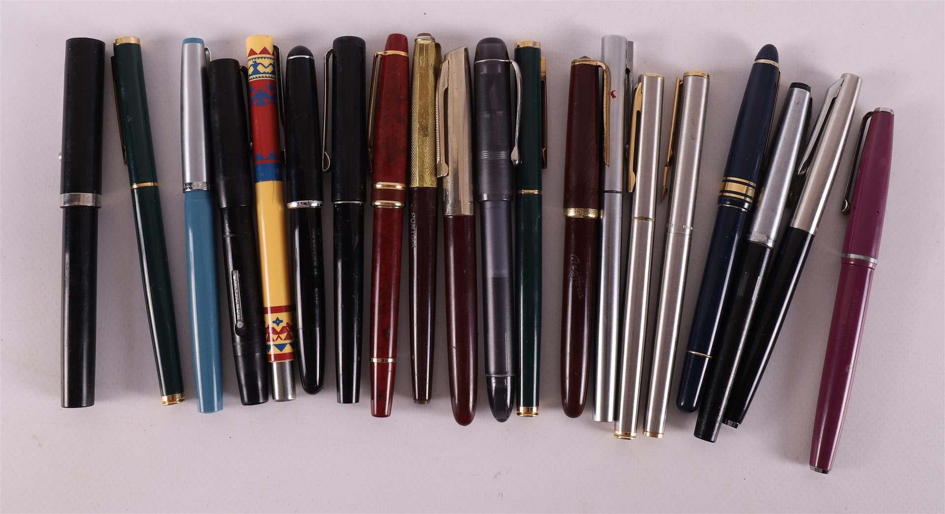 A lot of various fountain pens, including Parker and Shaeffer.
