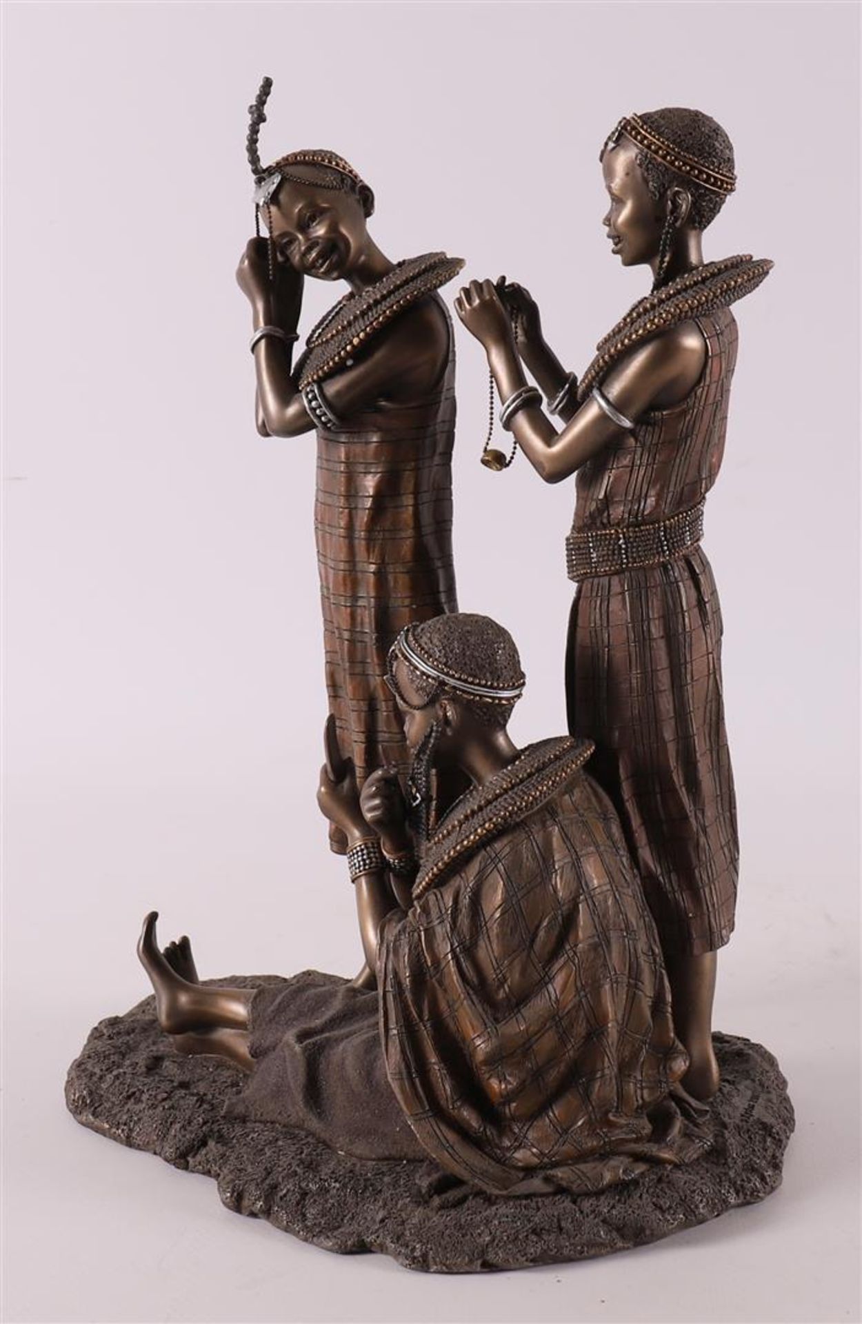 A bronze sculpture group 'Tayari Finischin Touches', reproduction, Africa. - Image 4 of 4
