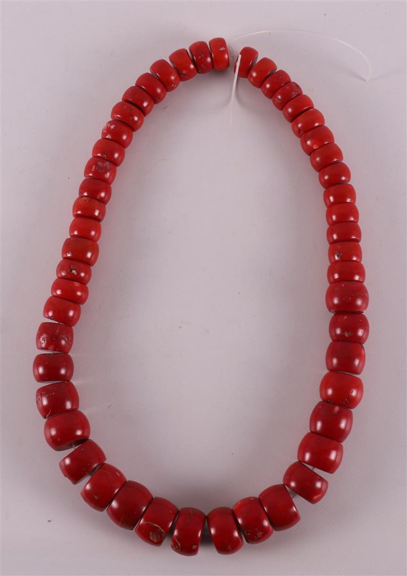 A necklace of coarse cheese-shaped red corals