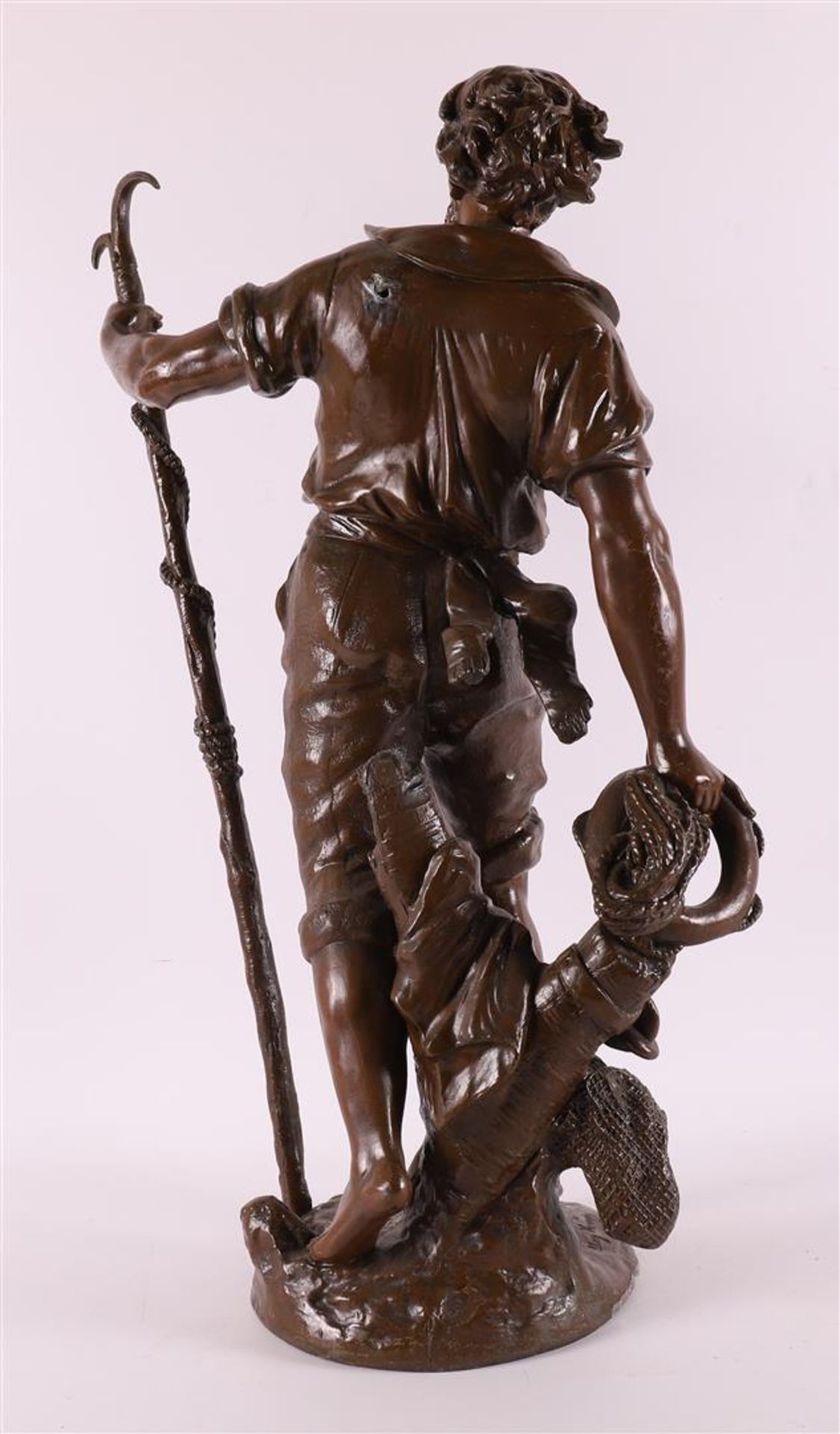 A brown patinated white metal 'samac' sculpture of a fisherman, France, - Image 3 of 6