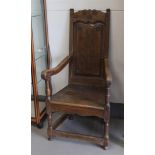An elm wood swaddling chair, England, 18th century.