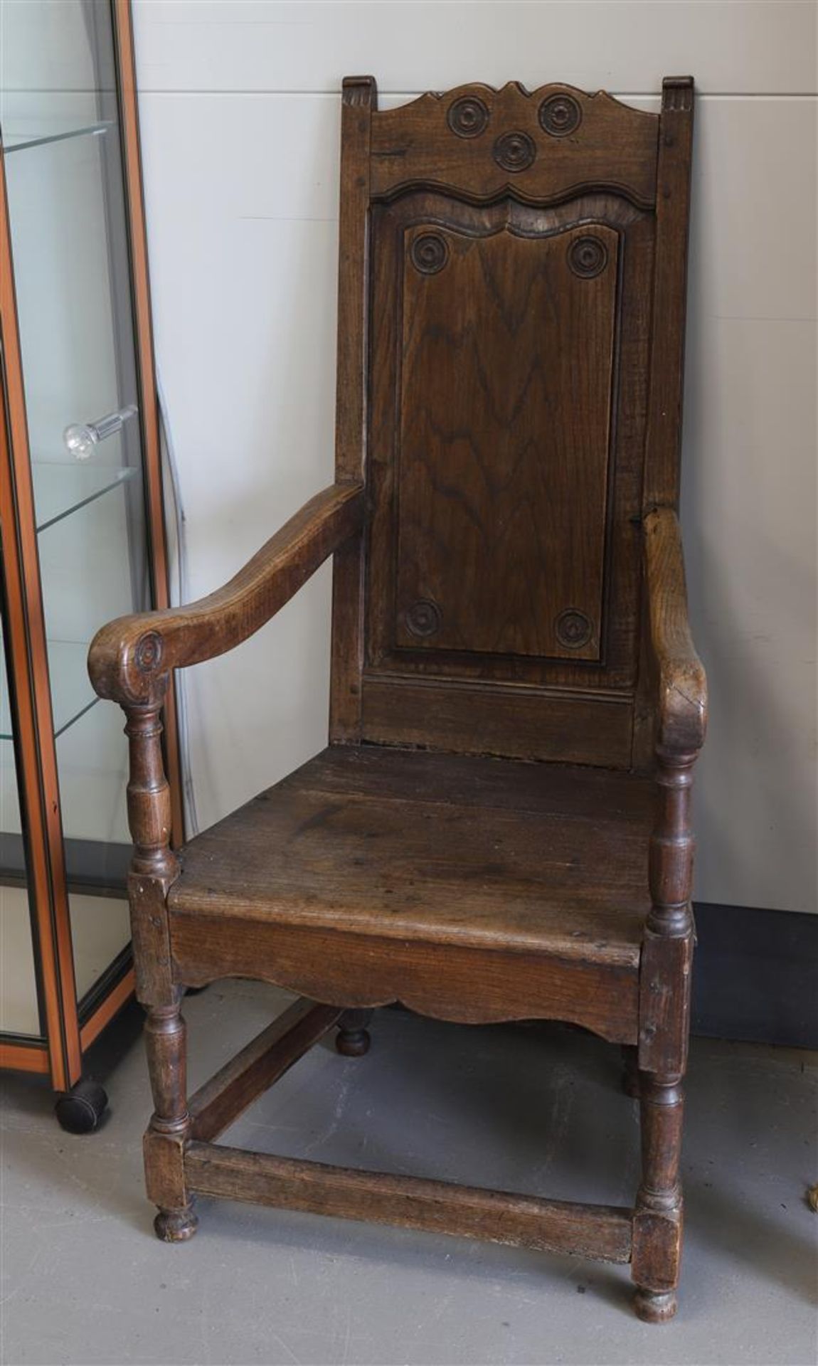 An elm wood swaddling chair, England, 18th century.