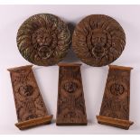 Two carved wooden rosettes of ringed lion heads, 18th century
