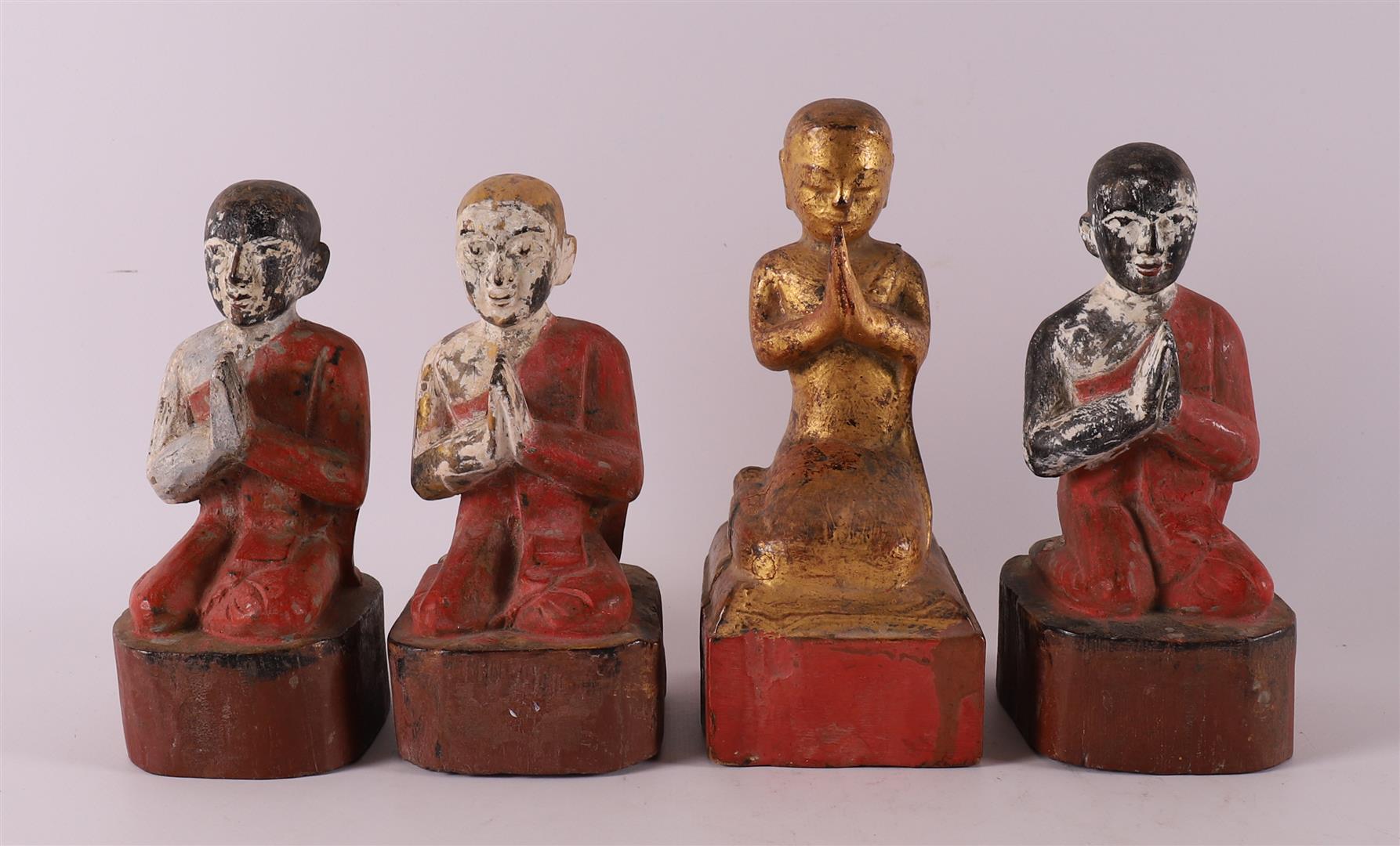 A series of carved wooden Burmese Buddhist monks, 19th/20th century