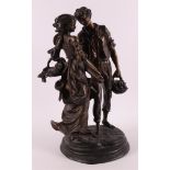 A brown patinated bronze sculpture of a man and woman, based on an antique examp