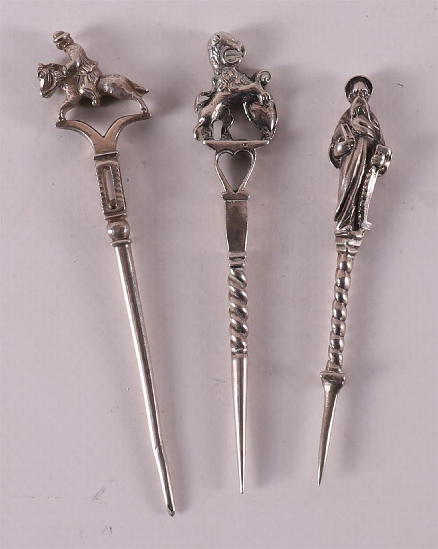 Three second grade 835/1000 silver pipe sticks, 19th century.