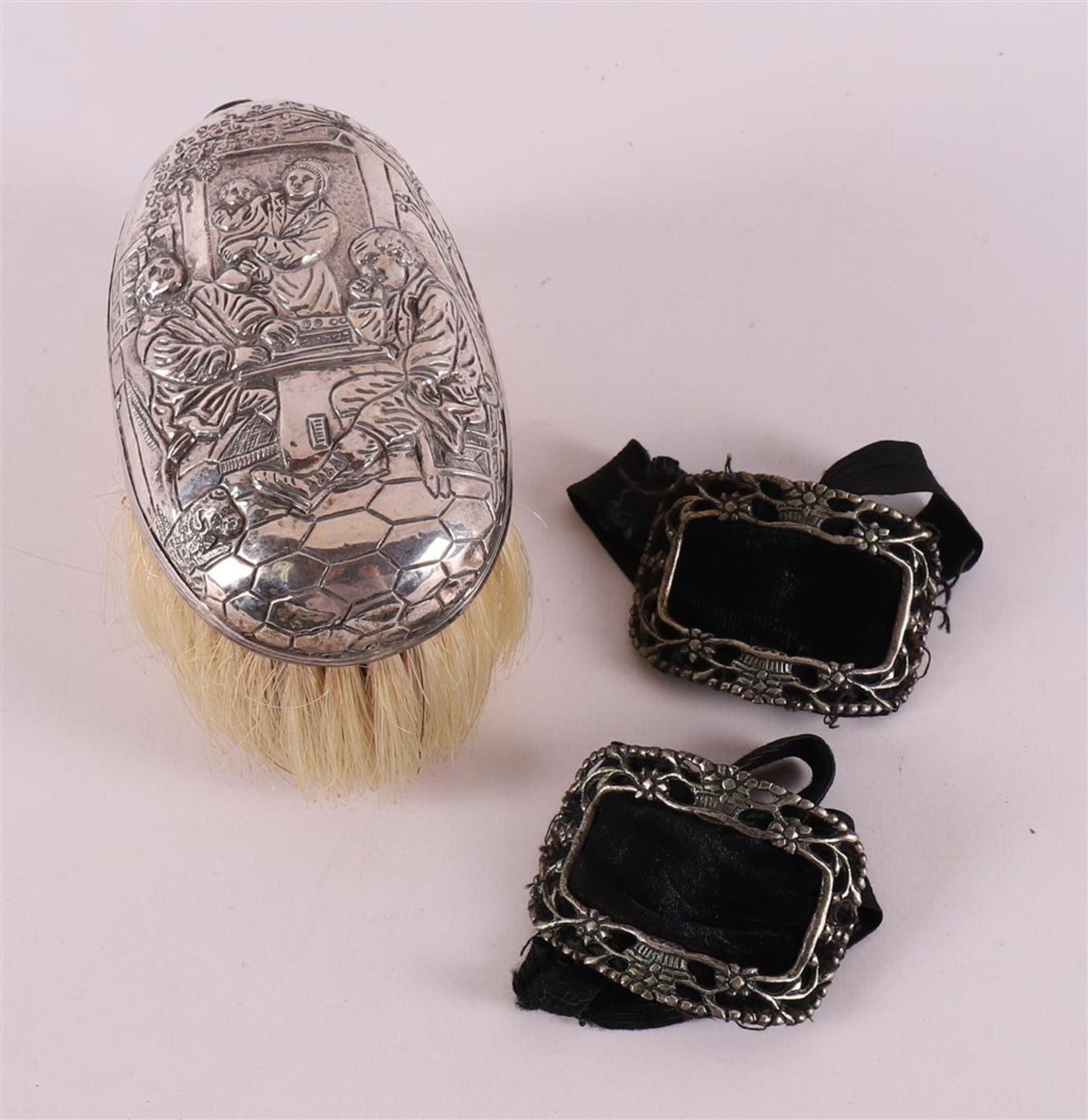 A clothes brush with second grade 835/1000 silver handle.