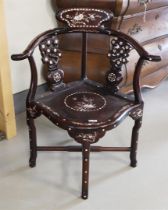 A tropical wooden model armrest armchair, China, 20th century.