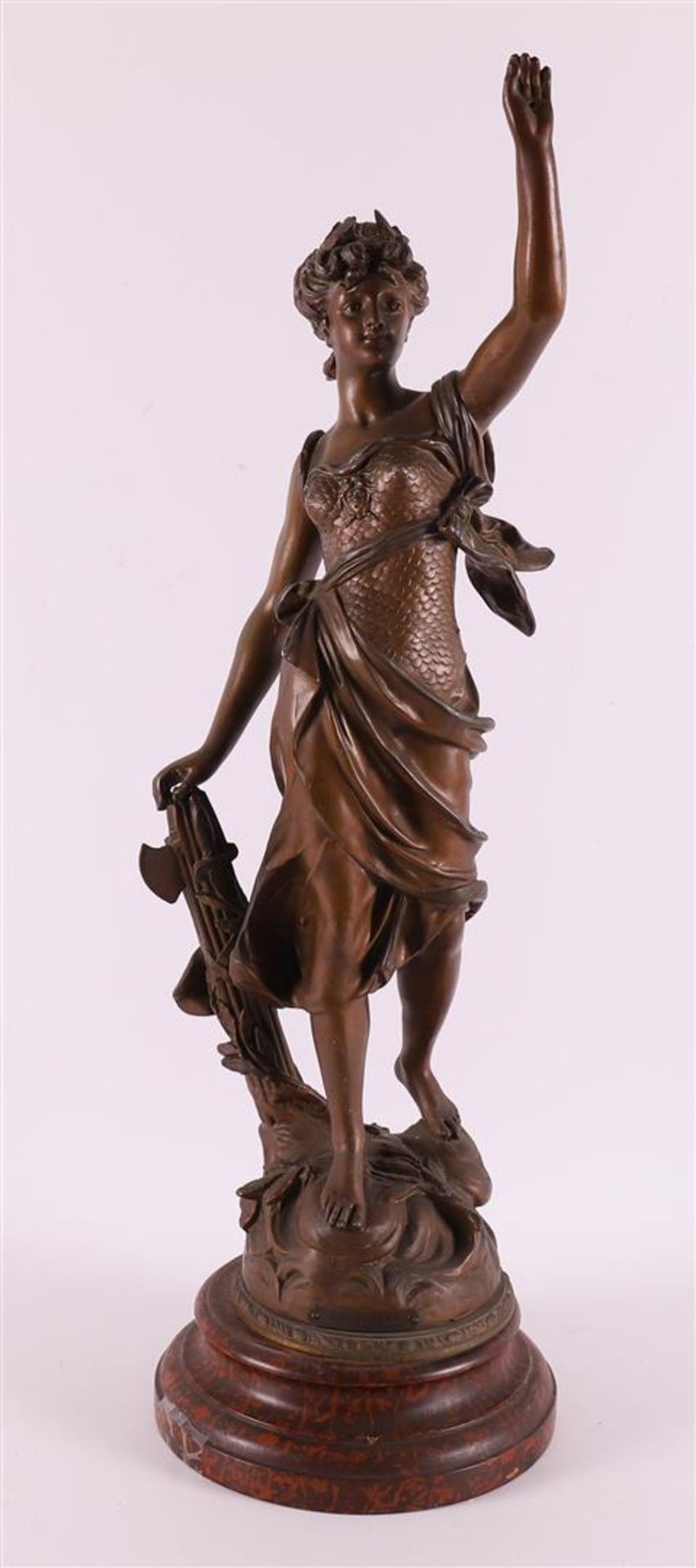 A brown patinated white metal woman 'La Gloire', France around 1900.