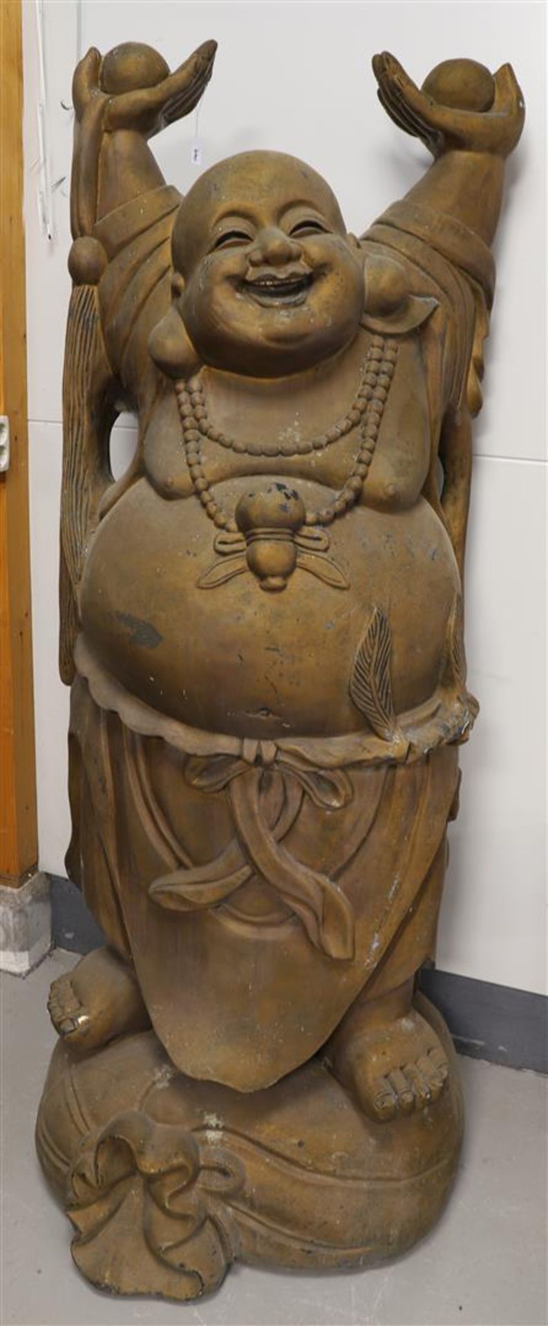 A large standing 'Lauching Buddha', 20th century.