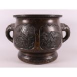A brown patinated bronze cachepot with elephants for ears, China, around 1900