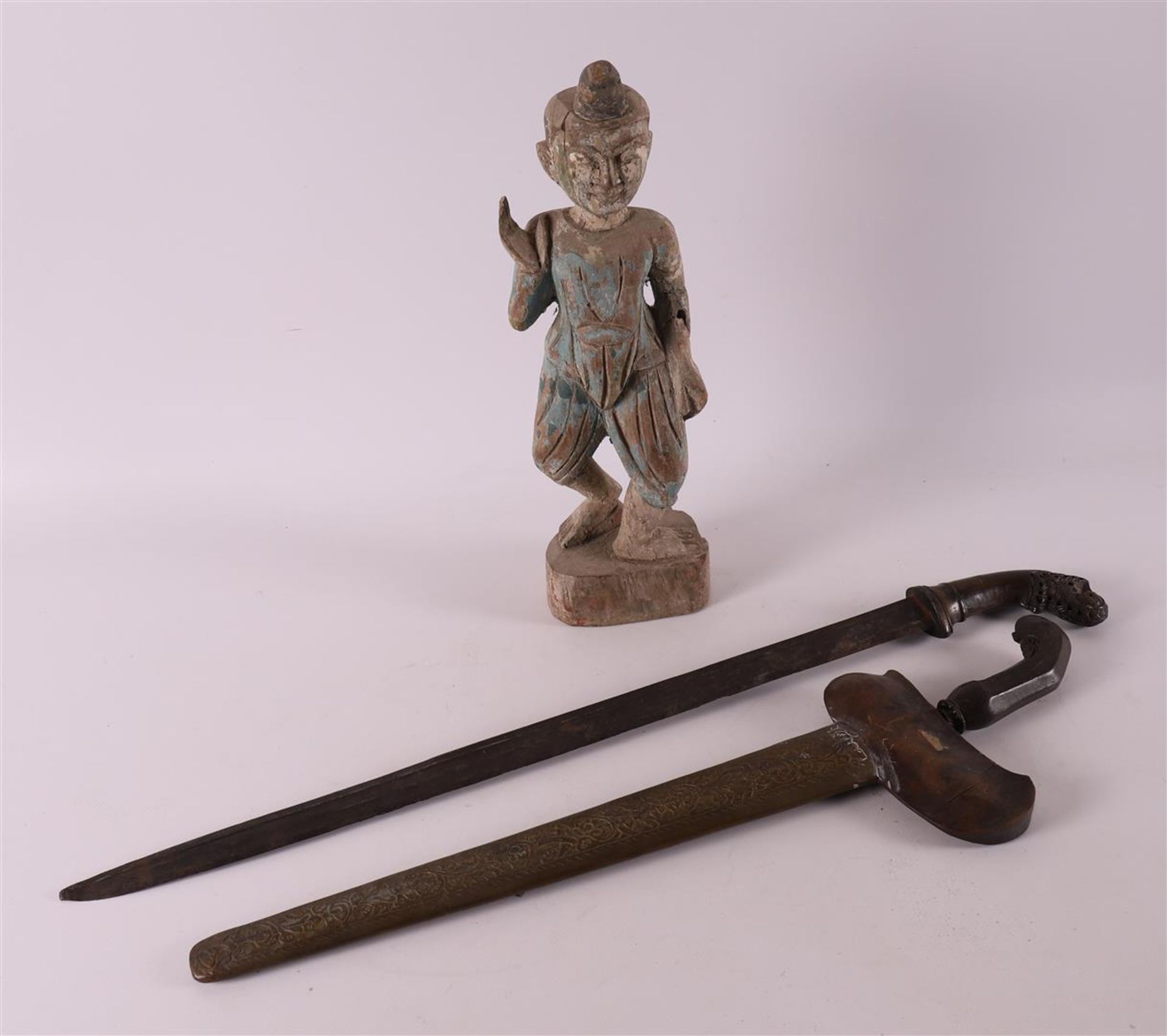 A lot of various Asian items, including kris and sculpture, 20th century