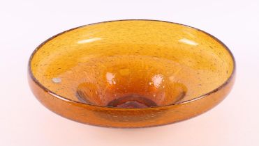 An amber-coloured blown bowl 'Antiqua', design: Max Verboeket.
