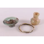 A Roman glass vase and bowl and bracelet, 2nd - 4th century.