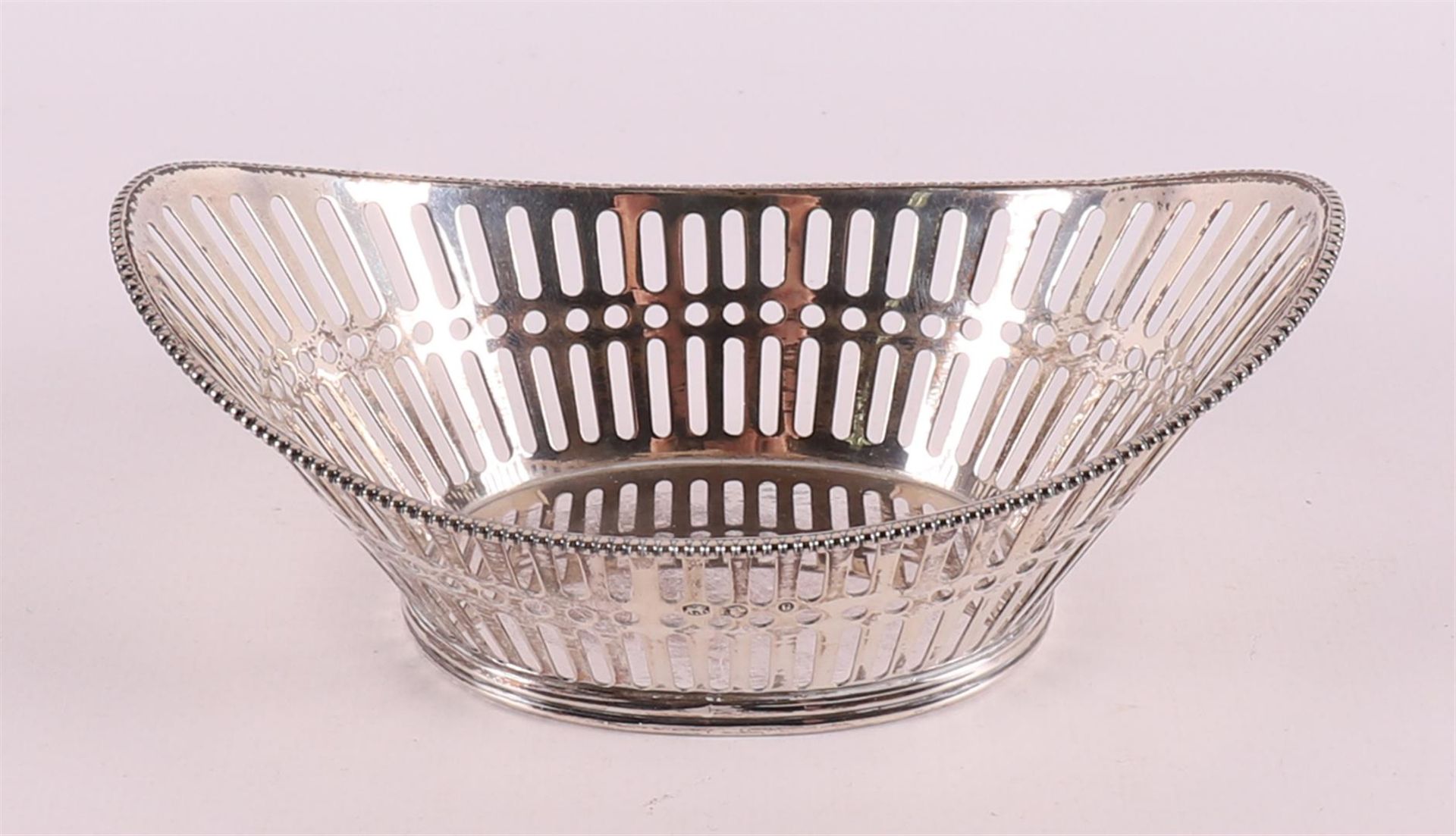 A second grade silver boat-shaped chocolate basket, 1952.