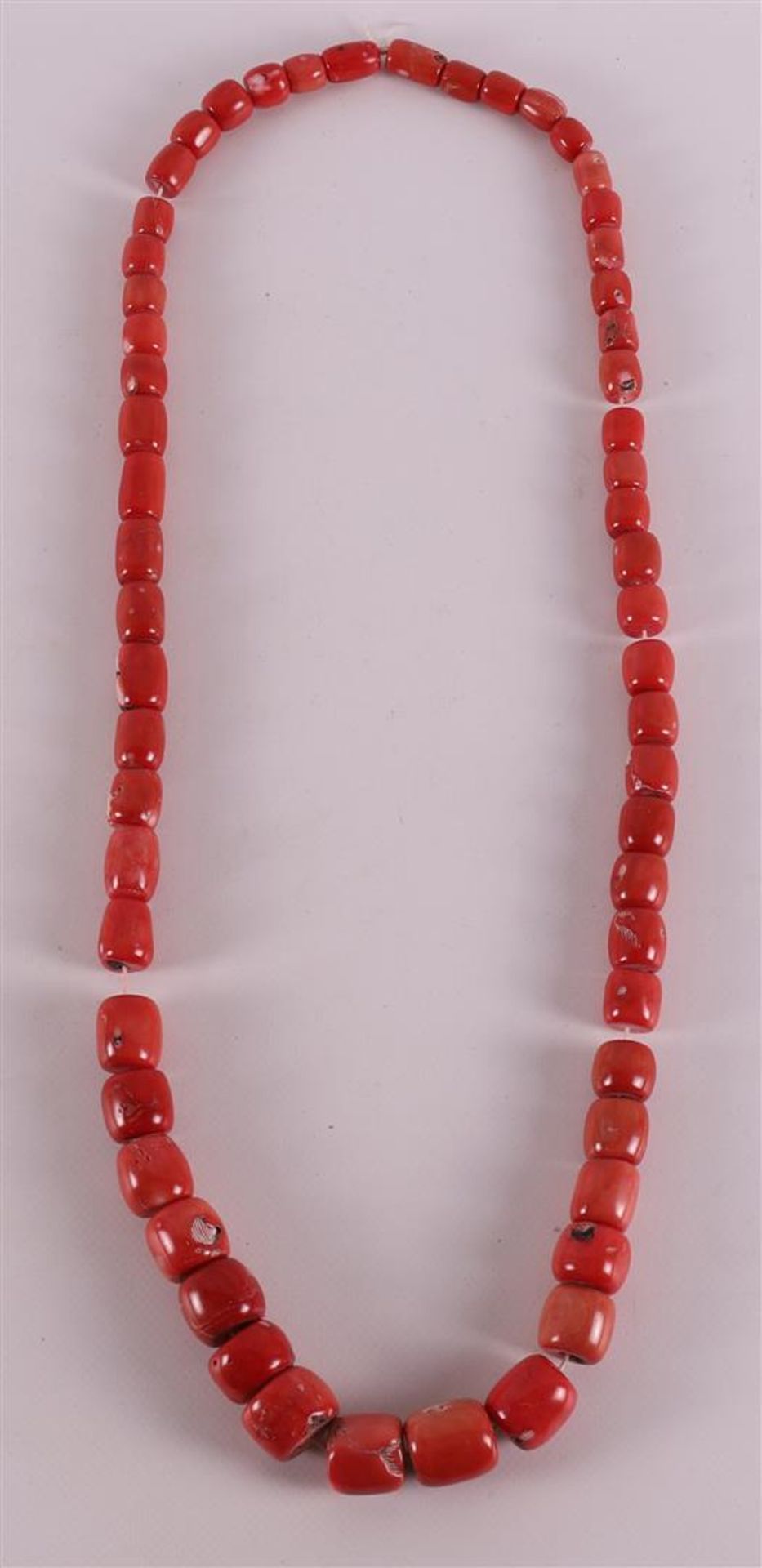 A necklace of coarse ascending red corals