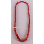 A necklace of coarse ascending red corals