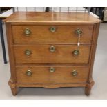An oak three-drawer chest of drawers with brass ring fittings, early 19th centur