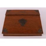 An oak travel/writing box with Art Nouveau brass fittings, around 1900.