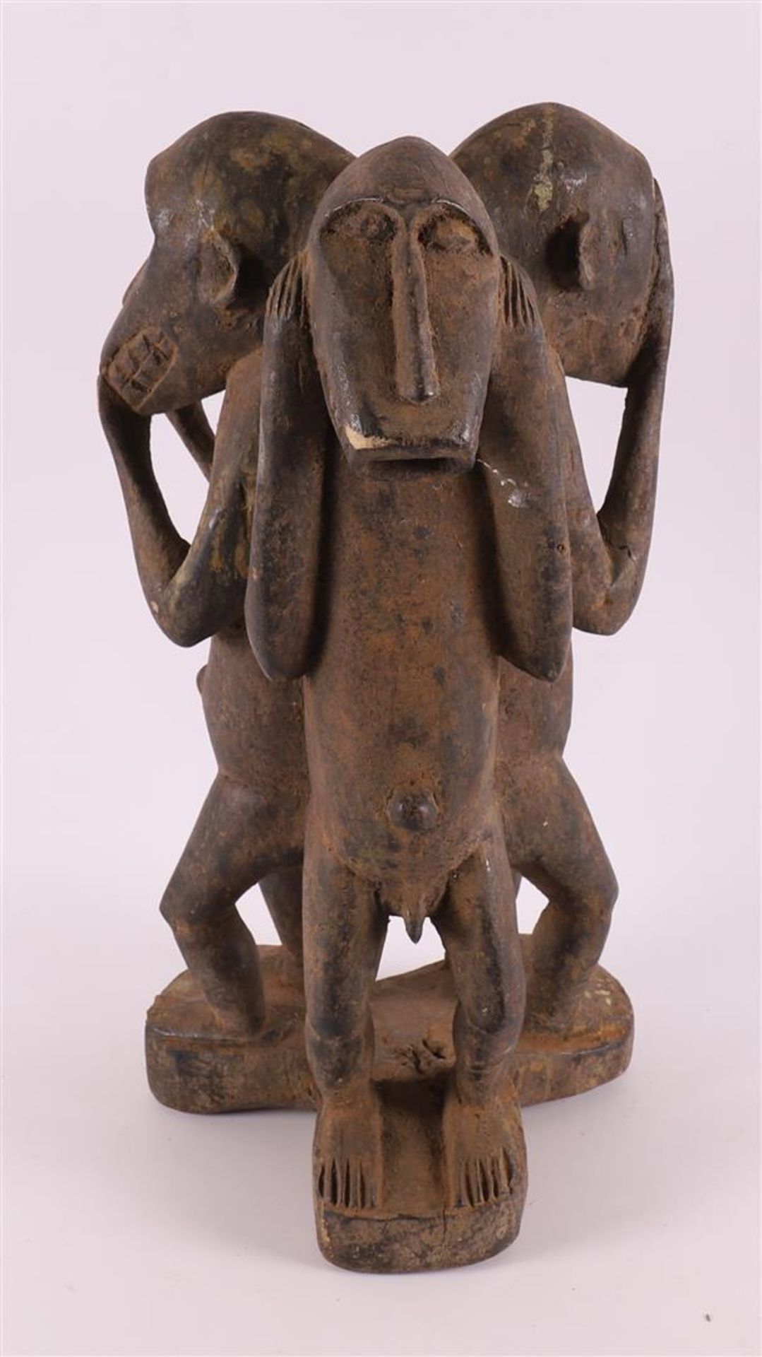 A carved sculpture 'Hear-See-Silence', Africa, 2nd half of the 20th century.