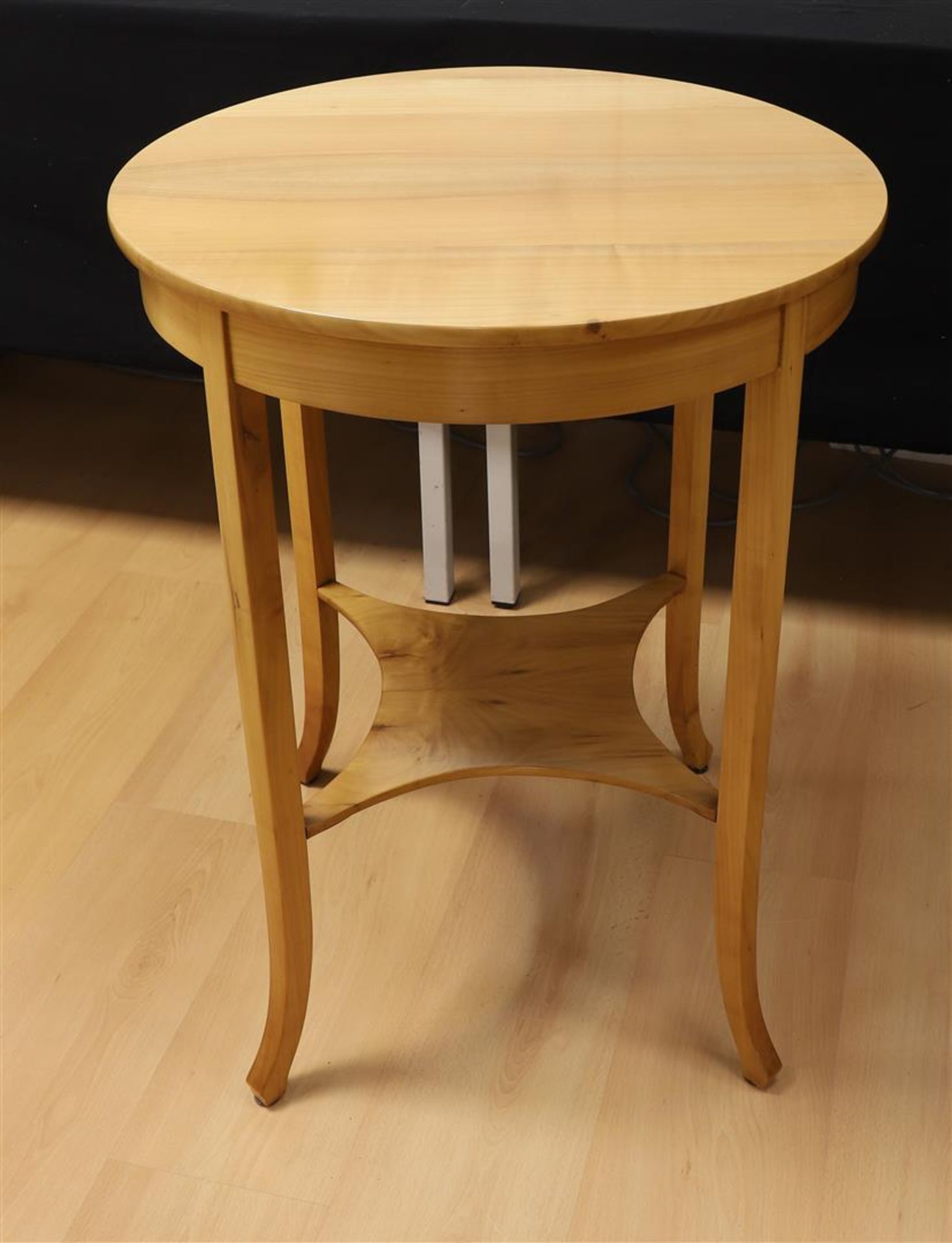 A round veneered wooden coffee table, 1st half of the 20th century.