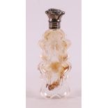 A crystal odeur bottle with silver flip cap and frame, including stopper,