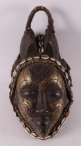 A carved wooden and brass 'Mourning mask', Punu, Gabon, Africa, 20th century