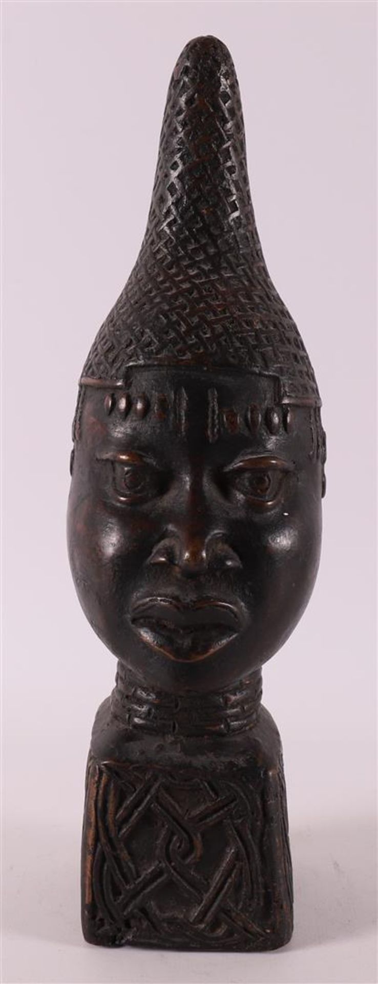 A brown patinated bronze bust of a mother, Benin style, 20th century.