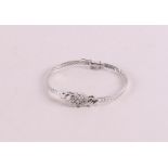 A 14 kt white gold bracelet with 9 diamonds.