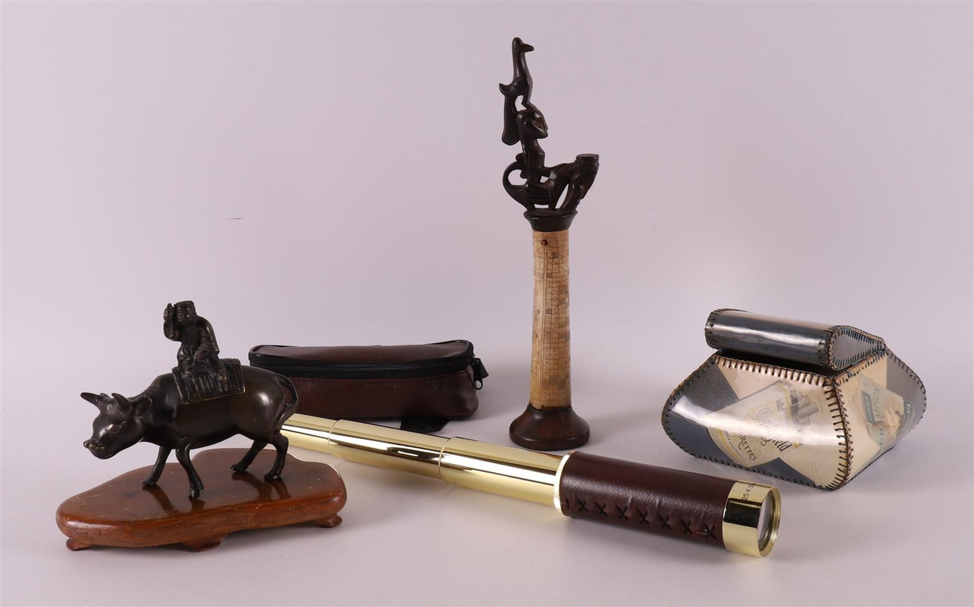 A lot of miscellaneous items, including bronze buffalo and binoculars, 20th cent