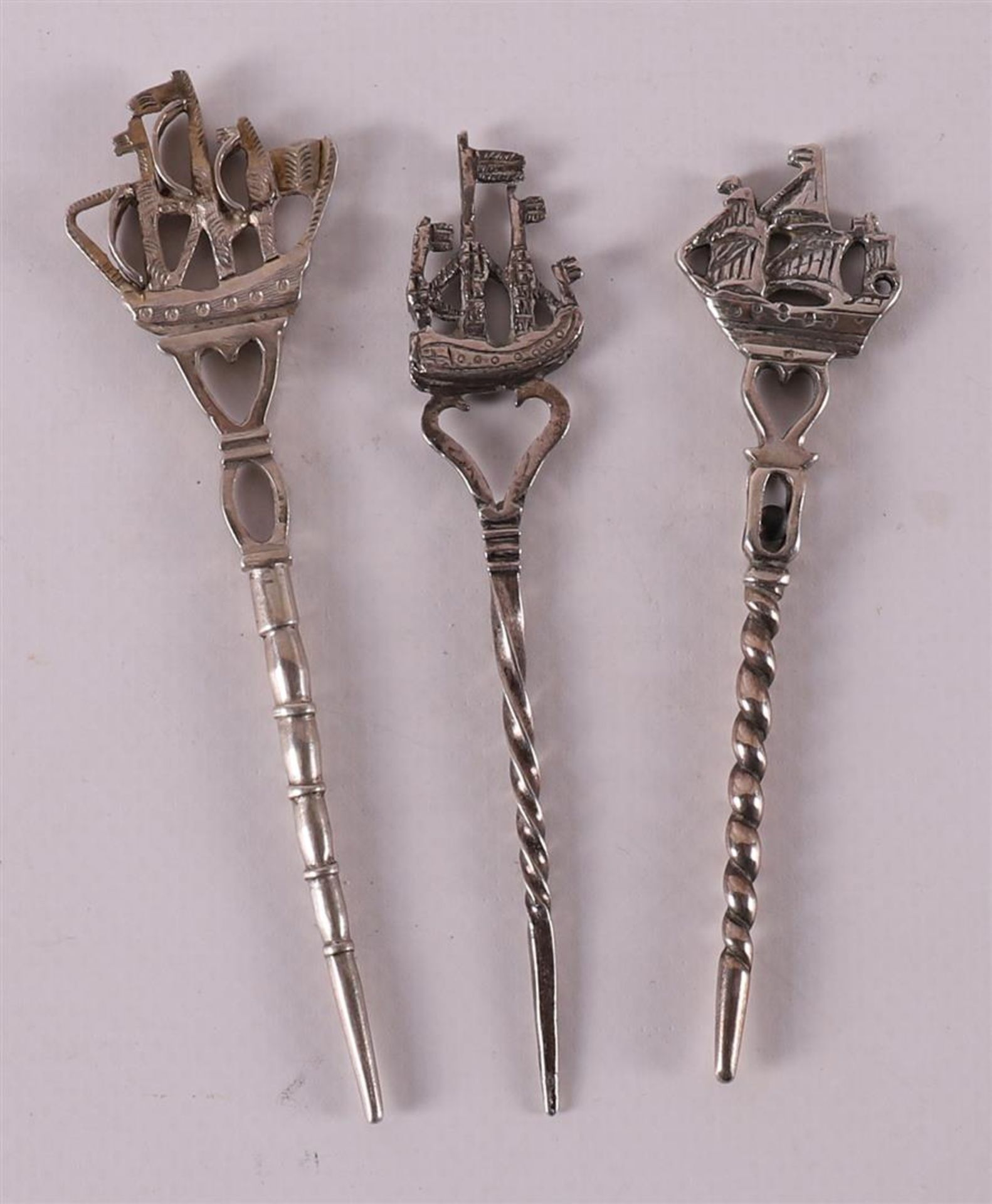 Three second grade 835/1000 silver pipe sticks, 19th century.