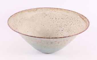 A conical cream-glazed earthenware bowl, marked: Zaalberg, ca. 1960
