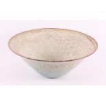 A conical cream-glazed earthenware bowl, marked: Zaalberg, ca. 1960