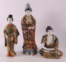 Four porcelain Satsuma figures, including geisha and Buddha, Japan, Meiji, 20th