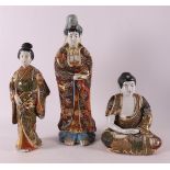 Four porcelain Satsuma figures, including geisha and Buddha, Japan, Meiji, 20th 