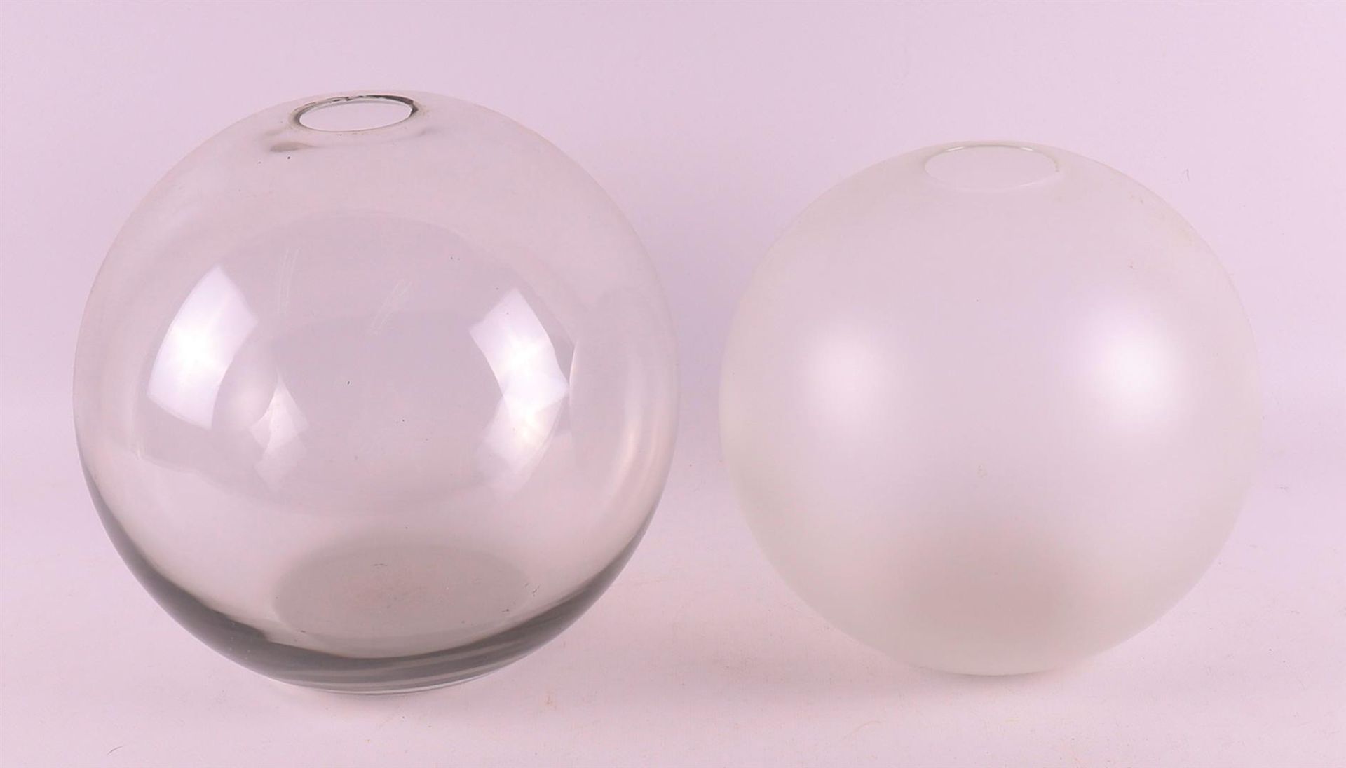 Netherlands, Leerdam. Two spherical glass vases, design: A.D. Copier