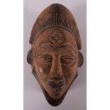 A carved wooden Punu mask, Gabon, Nigeria, Africa, 2nd half of the 20th century