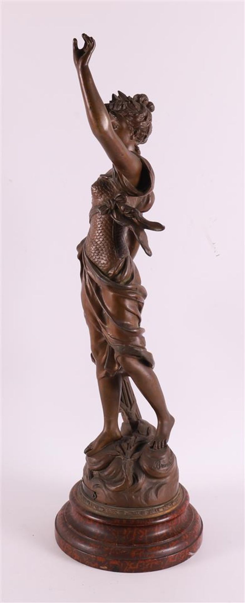 A brown patinated white metal woman 'La Gloire', France around 1900. - Image 4 of 5